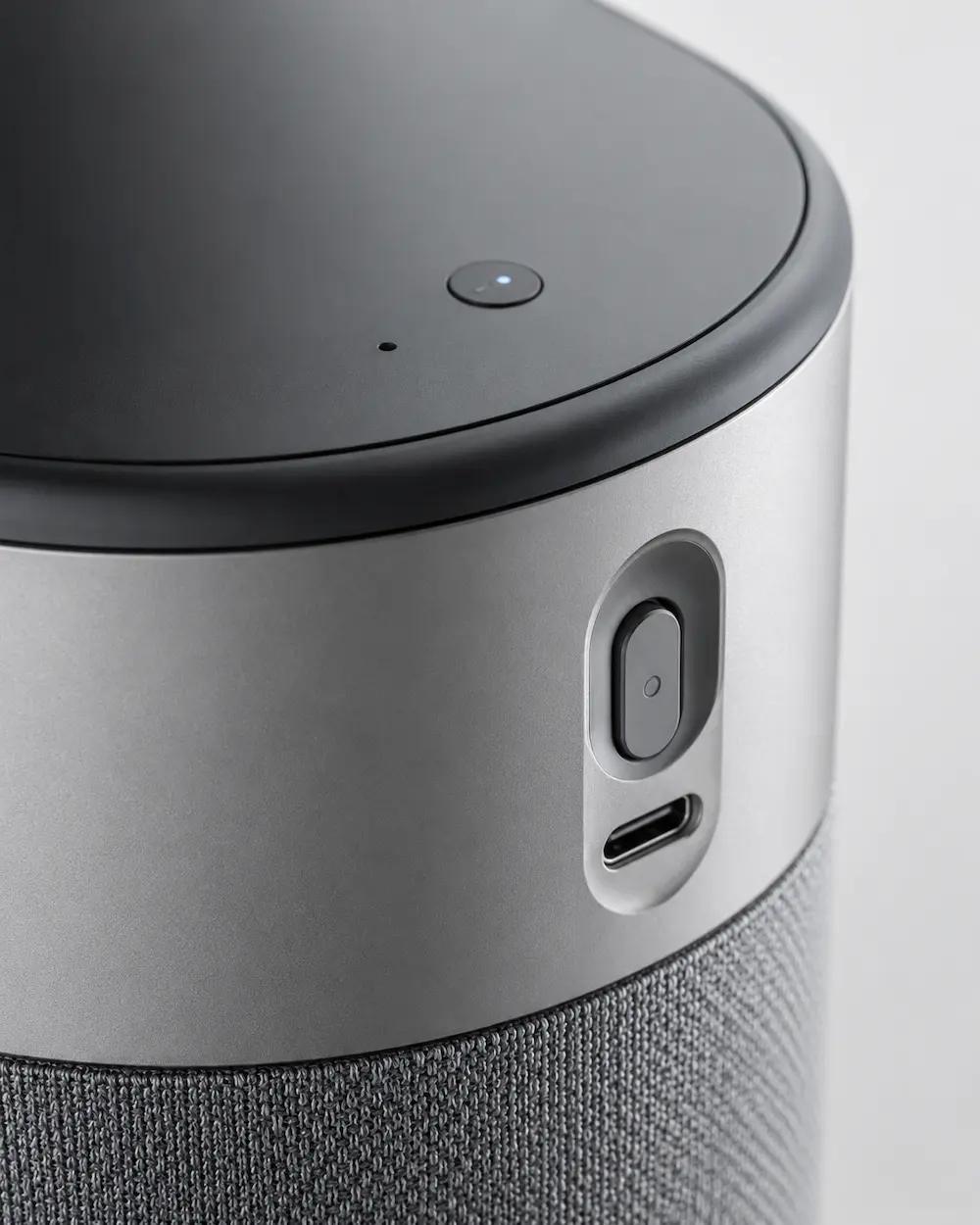 Close-up smart home product detail showing button finish interface port housing seam and surface quality